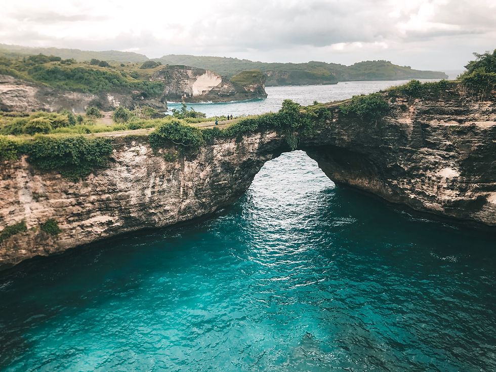 arch tunnel and turquoise waters broken beach nusa penida