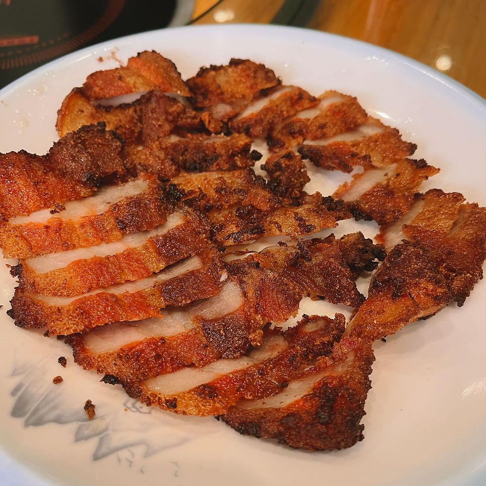 Deep-fried pork dish for lunch at Xinyuan Farm in Guilin, Guangxi, China