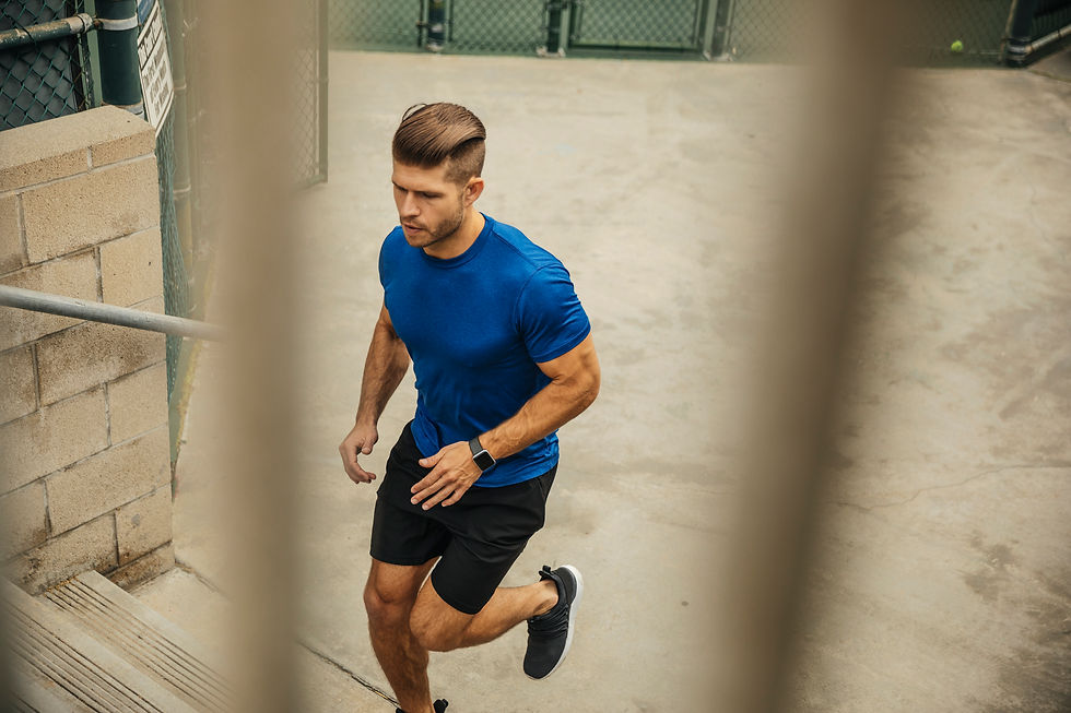 Dan does stairs... in athletic shorts with built-in compression and shoes that'll collapse conveniently in his travel bag.