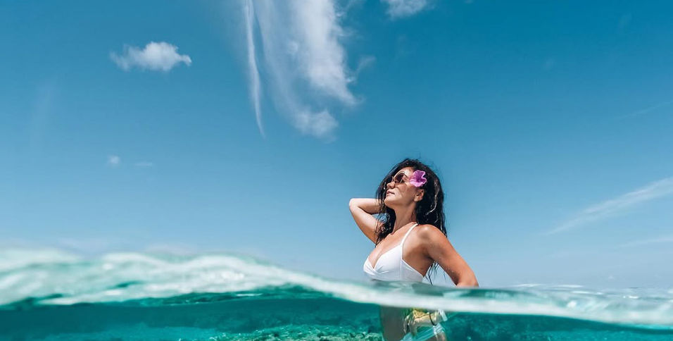 Woman in shallow water Maldives photoshoot