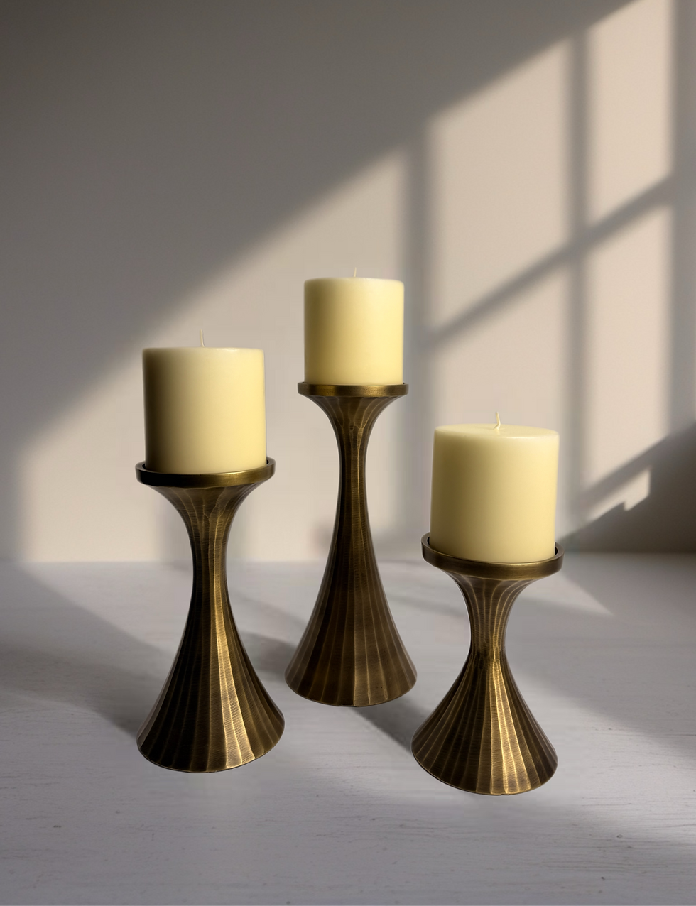 three piece Torre & Tagus aluminum candle holder front view