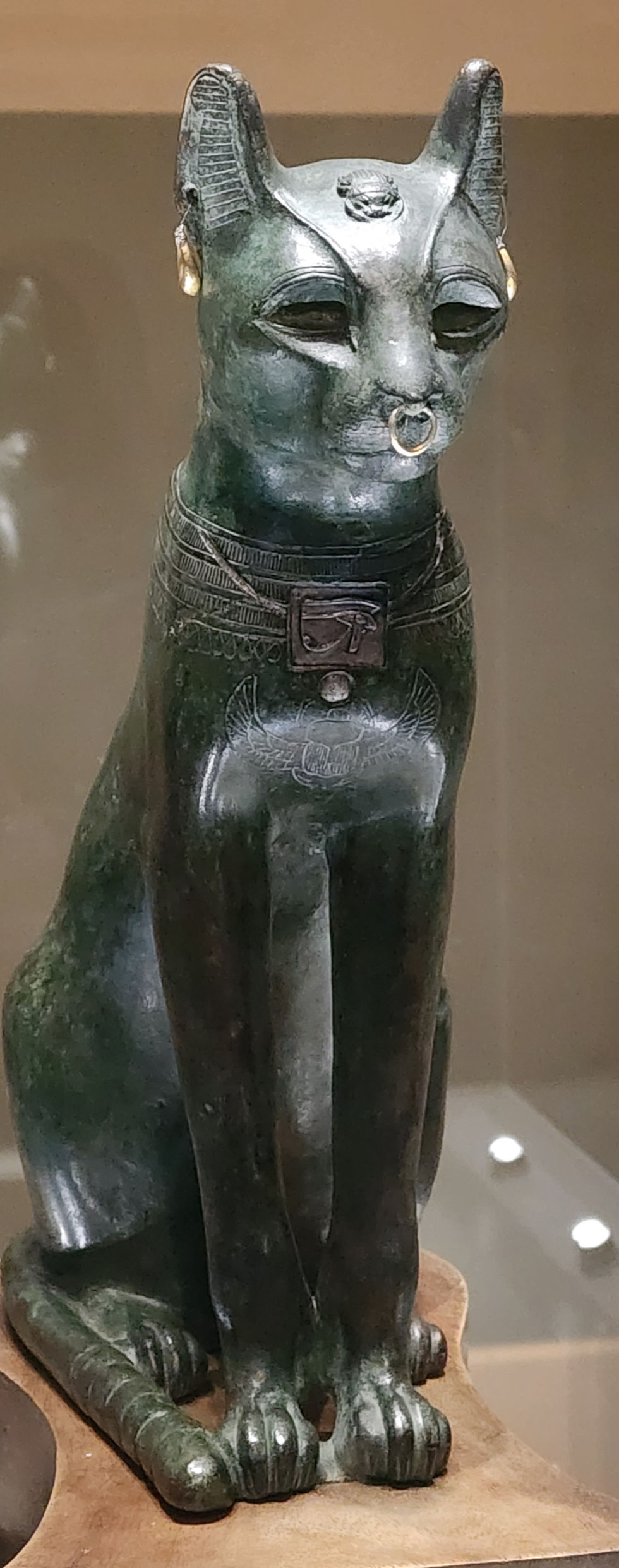 An ancient Egyptian cat statue symbolizing rituals and spirit work