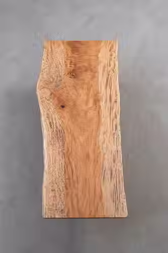 Japanese Tochi (Horse Chestnut) is a slow-growing hardwood prized for its fine grain, smooth texture, and gentle warmth. Its rarity and stability make it ideal for luxury furniture and refined interiors. Each slab’s subtle variations reward closer observation and thoughtful appreciation.
You view wood as a canvas for light. You want an ethereal, blonde slab with rippling, silk-like grain (chatoyancy) that shifts and shimmers as you move around it.