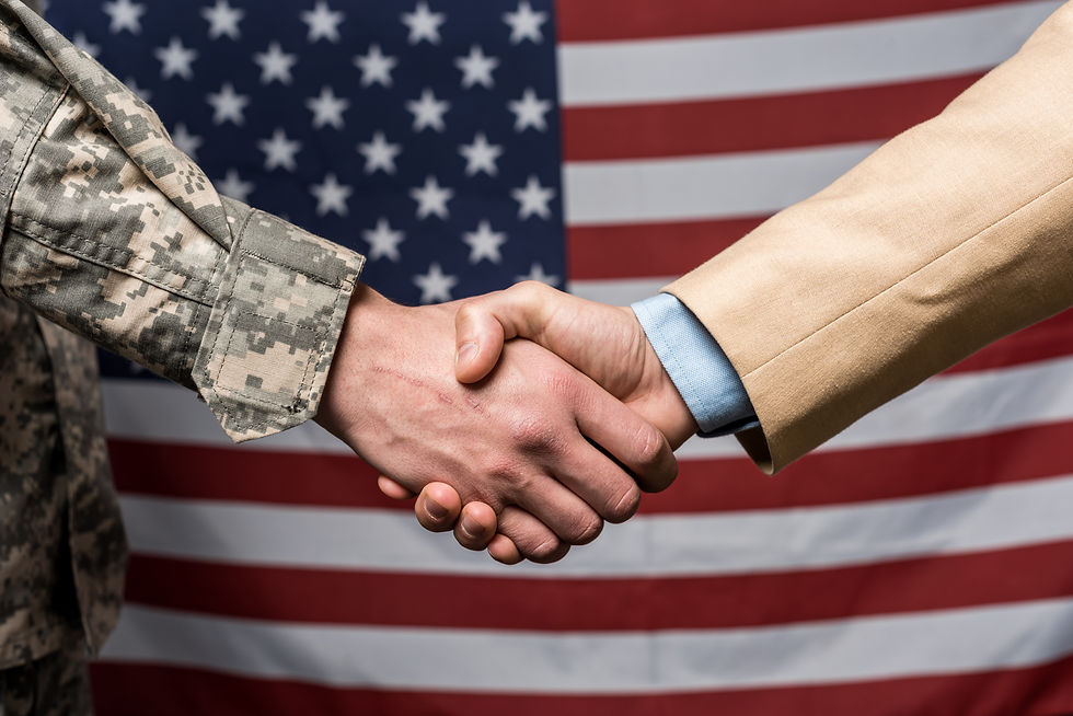 selective-focus-military-men-shaking-hands-near-am-2023-11-27-05-32-01-utc.jpg