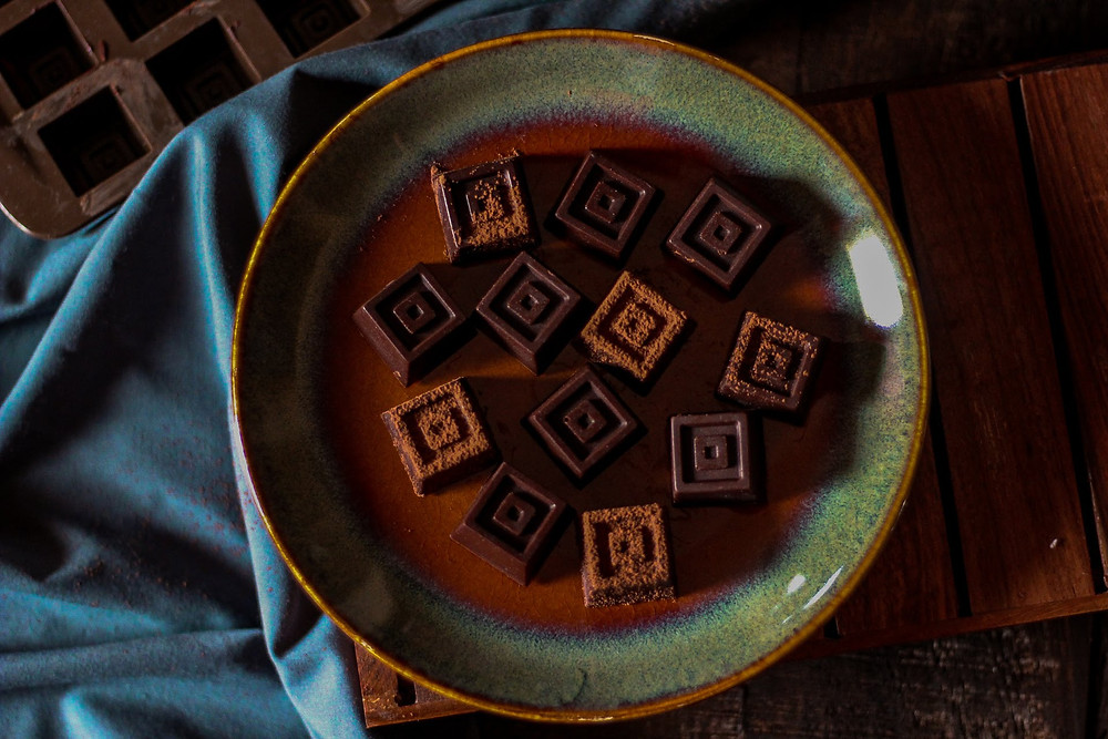 Individual chocolate pieces with hazelnut inside