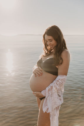 Maternity photo at the beach at sunrise