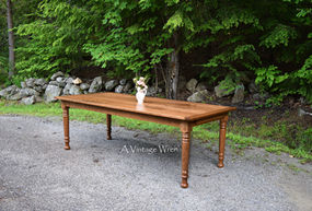 New Hampshire farm dining table made out of solid Cherry wood, it has breadboard ends and turned dining table legs