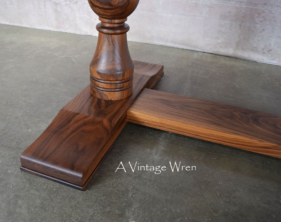 New Hampshire made oval dining table made of solid black walnut with traditional double pedestal turned trestle base