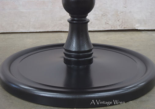 close up of a traditional turned dining table base