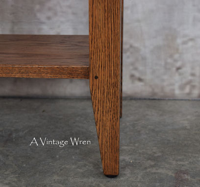 a close up of a New Hampshire made solid wood kitchen island with lower shelf, Shaker style leg