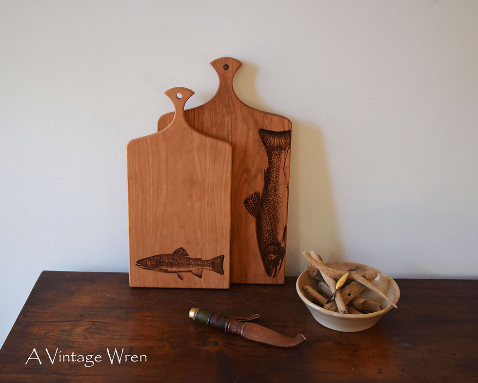 Thumbnail: Solid wood cutting board with fish engraving. Brook trout engraved on a charcuterie board