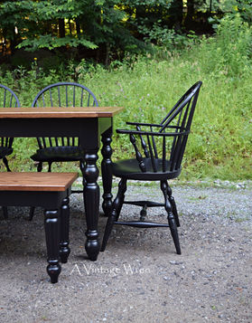 dining table with black painted Windsor chairs
