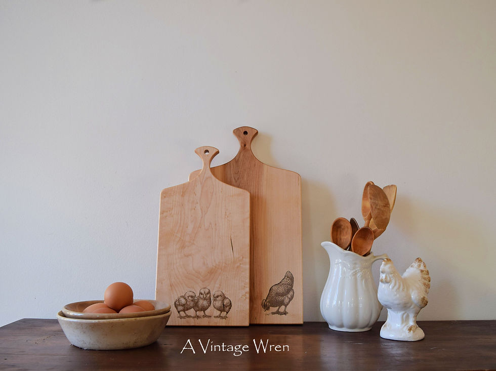 Thumbnail: Large and small maple cutting boards with hen and chick engravings