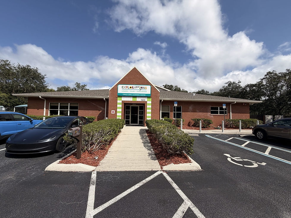 Brick exterior and school sign over the front entrance at Explorations Child Care, Oviedo, FL
