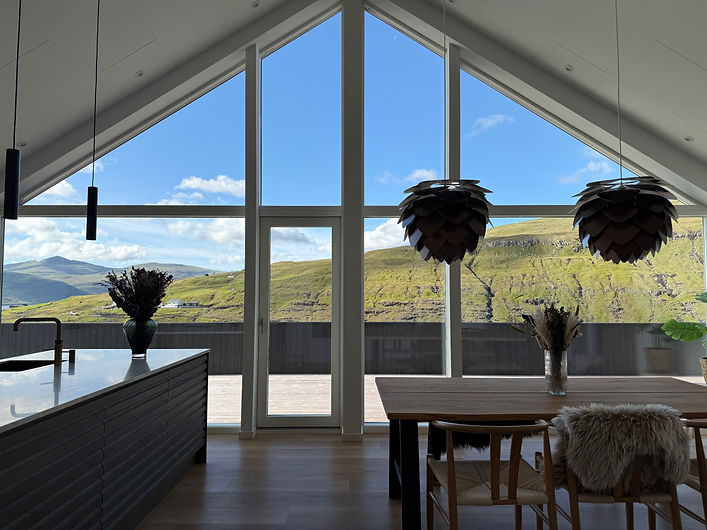    Leynastova luxury villa exterior with Faroe Islands mountain views