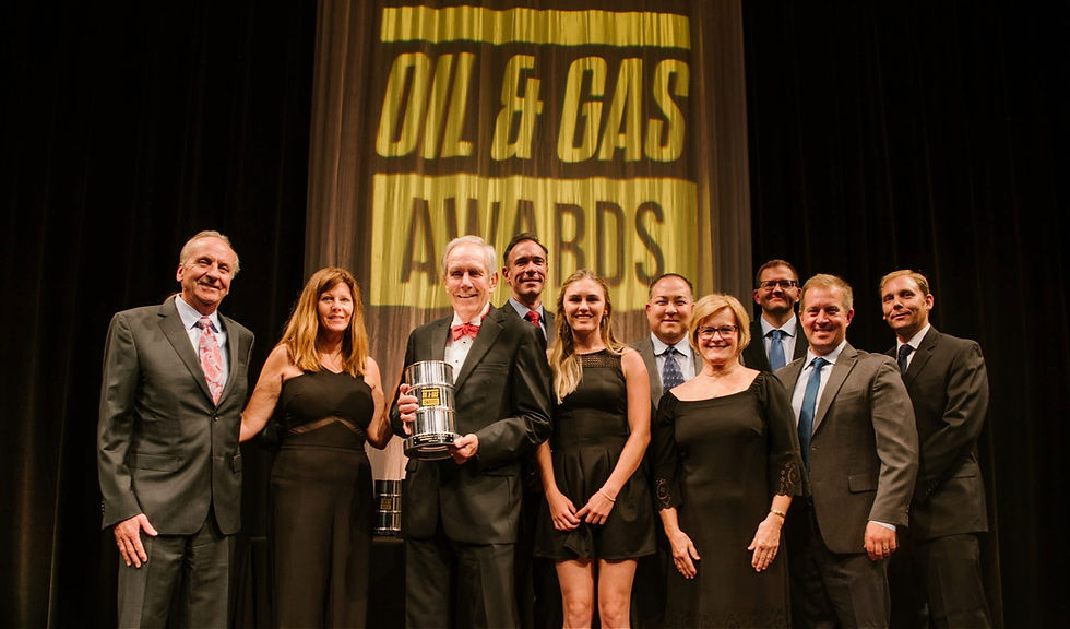 Well Master executives and guests accepting an award at the Oil and Gas Awards