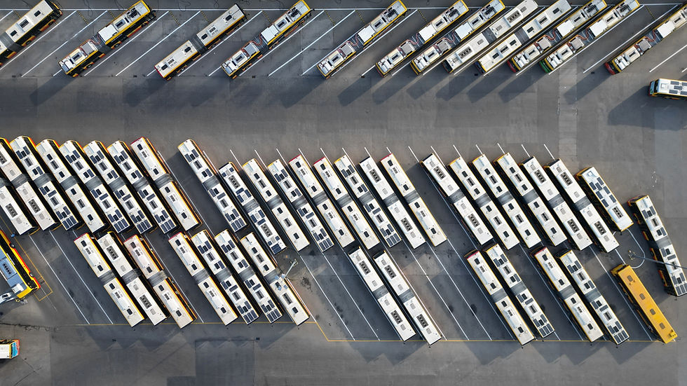 Aerial top down shot of bus terminus, designated place where bus or coach starts or ends i