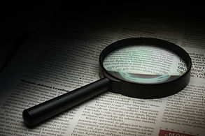 Magnifying glass placed on a article 