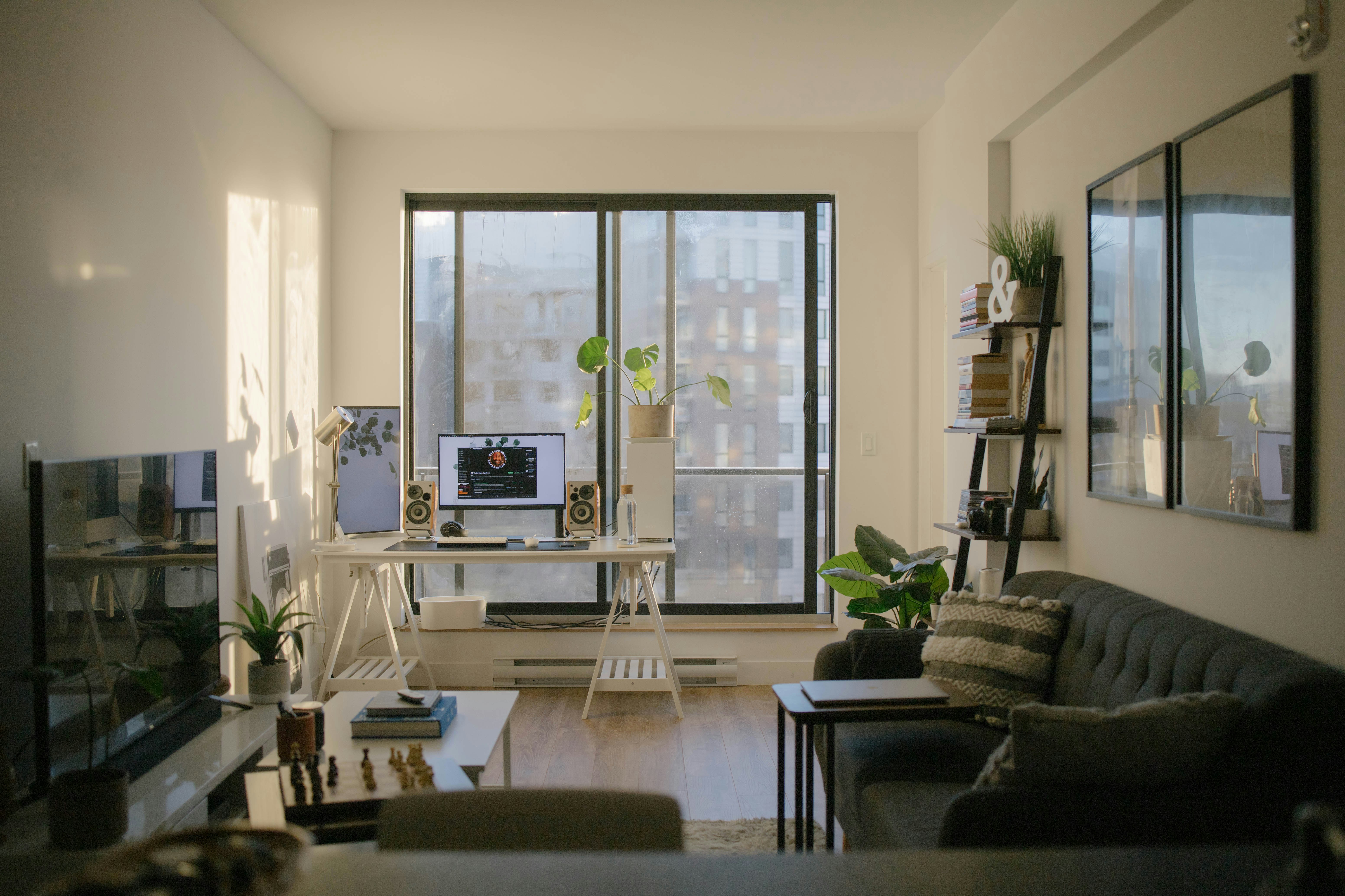 Furnished apartment living room with a home office workspace