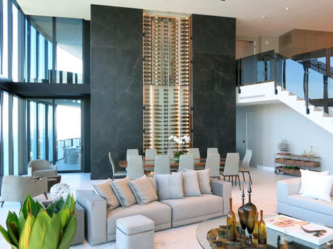 luxury wine wall Porsche Tower Miami, floor-to-ceiling glass wine room, contemporary wine display, premium materials, high-rise wine cellar, Dragon Cellars