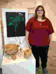 This year's first place winner, Esther Crisler, with her piece titled "Inversion of Importance"