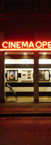 Neon Cinema Opera sign shining at night