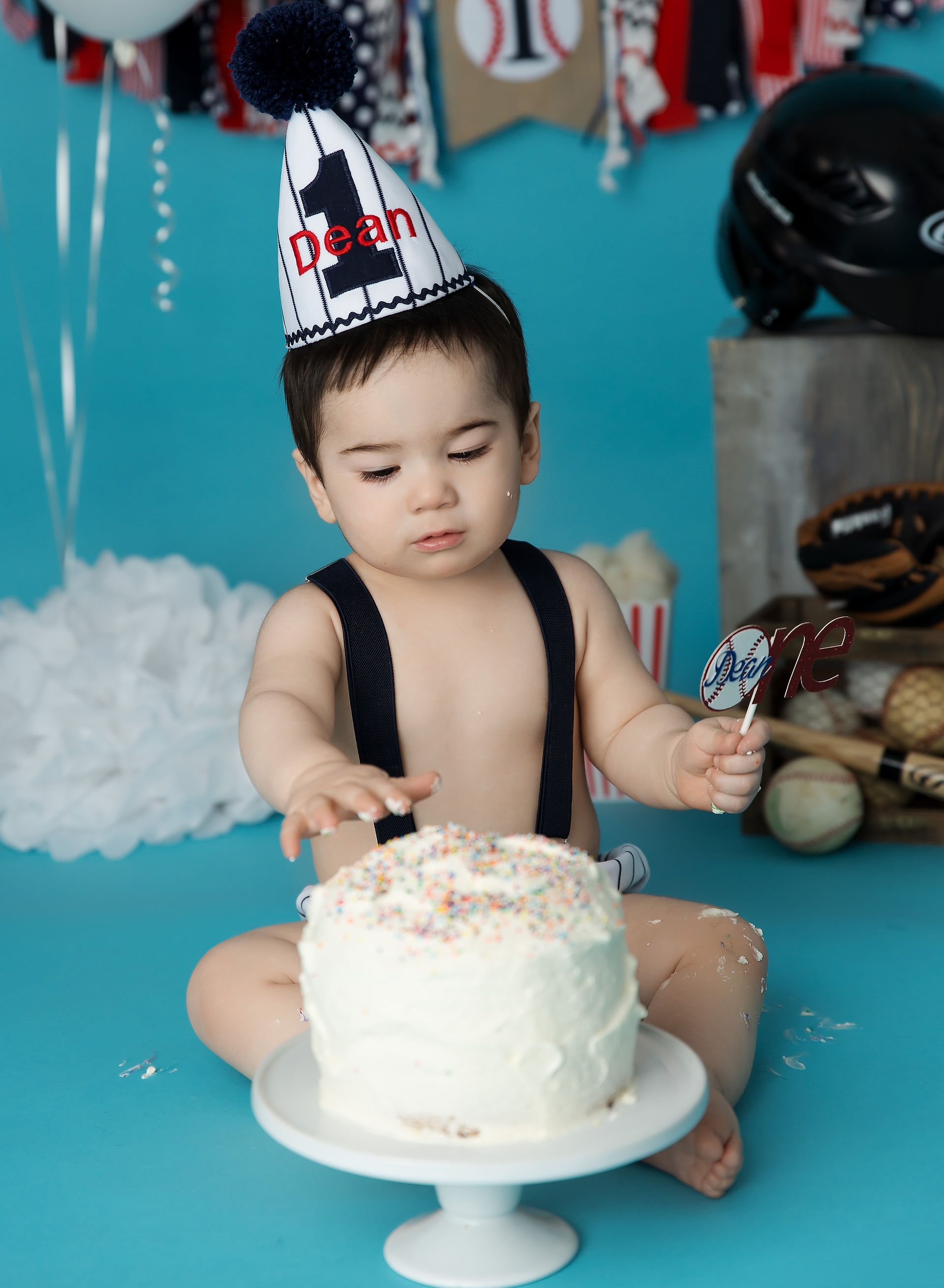boy having a healthy cake smash