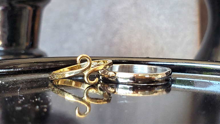 18k yellow gold ladies Swirl wedding band and half-round thin men's wedding band. Created by Katherine Spencer in Morgantown, West Virginia, USA