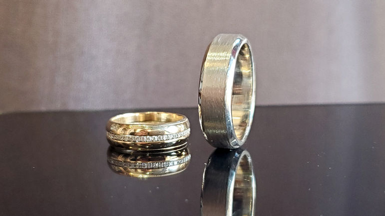 repurposed ladies wedding band and beveled edge men's wedding band in 14k white gold. Created by Katherine Spencer in Morgantown, West Virginia, USA