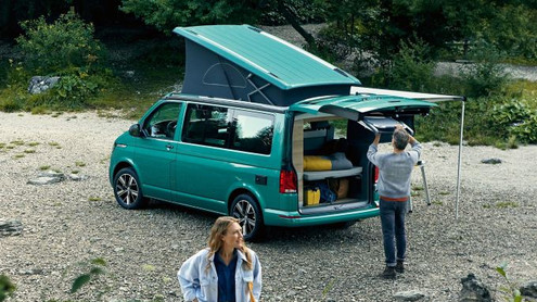 Bay Leaf Green VW California Ocean 6.1 with back open and family using it