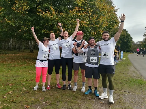 People celebrating after 10km run