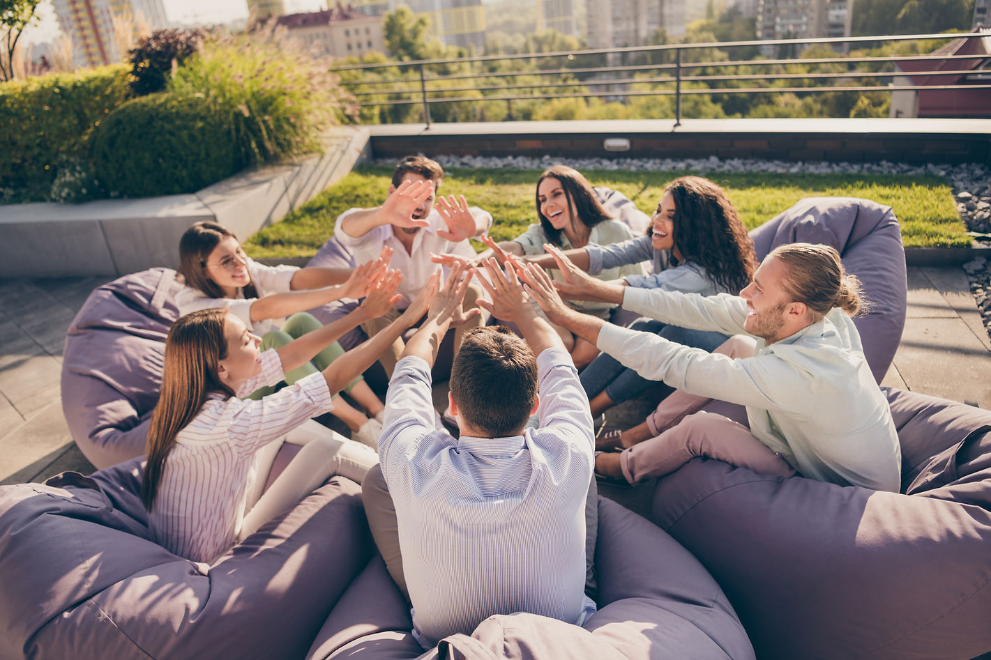 Photo of successful freelancers students sitting bean bags dealing corporate strategy work
