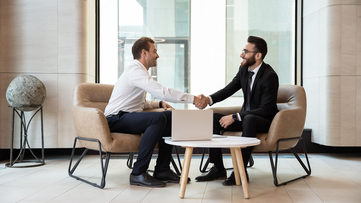 Horizontal view european and arabian businessmen in formal wear accomplish meeting shaking