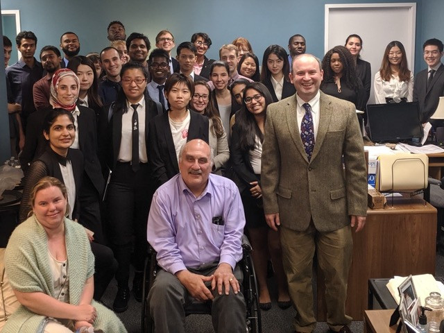 group of university of maryland graduate students standing with found of UserWorks, a usability lab in College Park, MD