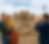 Kymi_Cinematic_Walkthrough_A_family_poses_in_front_of_a_large_sand_sculpture_ZiYVMTUh.png