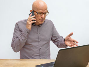Frustrated man trying to talk to his landlord