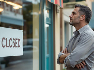 A business owner looking at his closed business.