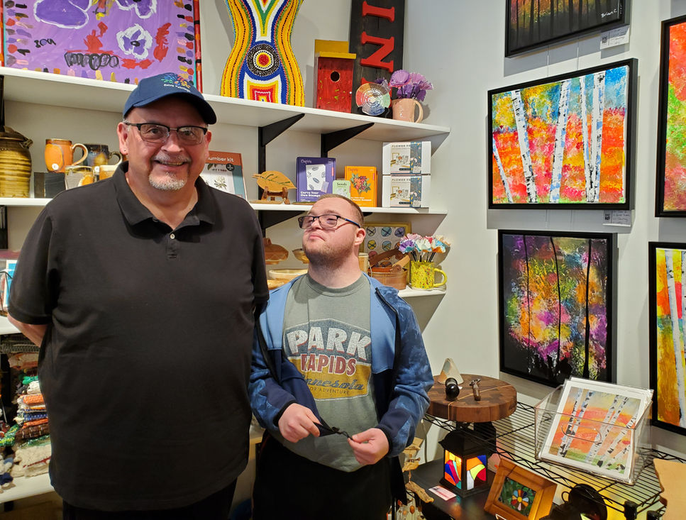 A participant displays his art at the gallery