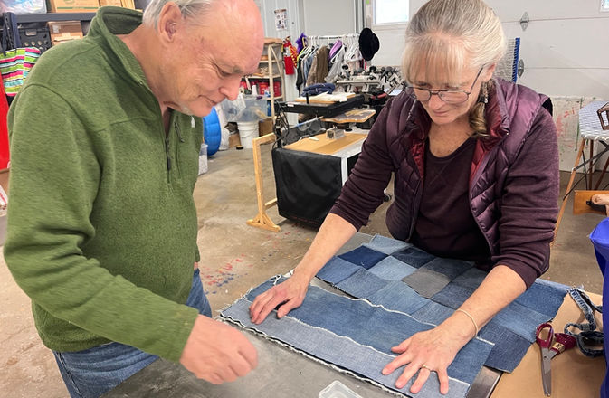 A participant works on a quilt
