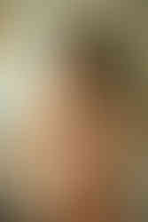 female model wearing lingerie in a mid century modern bathroom