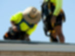 Roofer Drilling Into Metal Roof