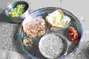 bajra millet bhakri (roti), onion curry, papad, tomato chutney, green grapes