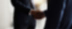 handshake with men's hands in suits