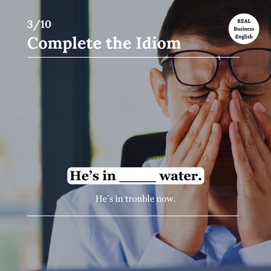 Business English idiom quiz card with the sentence He’s in hot water, showing a stressed office worker and an idiom about being in trouble at work.