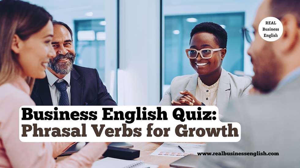 Four people smiling at a table with documents in an office. The text reads: "Business English Quiz: Phrasal Verbs for Growth."