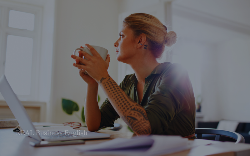 Business English Practice speaking practice: When priorities change, speaking lab with a professional woman holding a cup and thinking