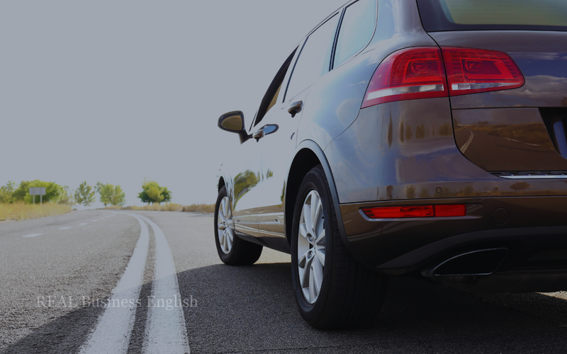 Car driving on a highway, representing automotive production and supply challenges