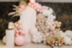 Birthday decorations - balloons, garland and decor for little baby party on a wall backgro