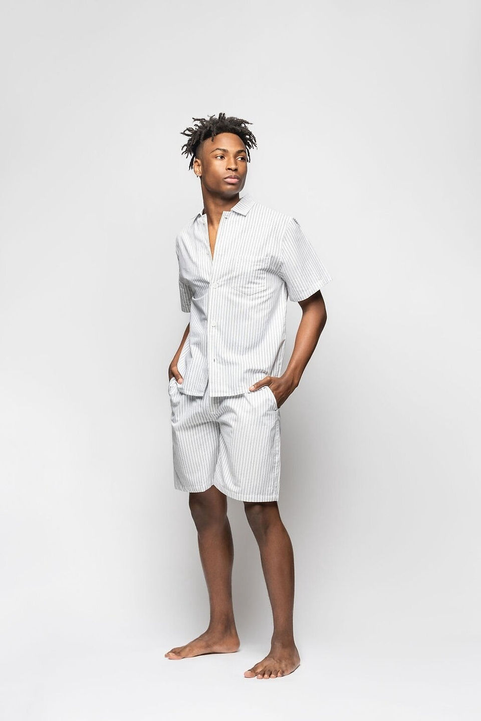 man with dreadlocks with hands in pocket wearing Men's Striped Loungewear Short