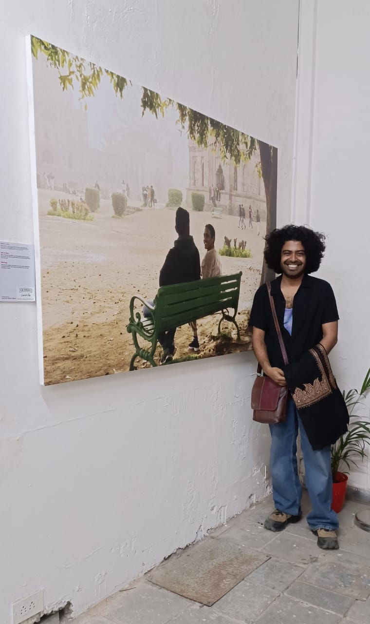 Photographer Raqeeb Raza with the pictures during the exhibition .